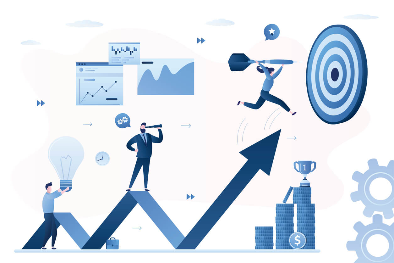 A group of people brainstorming goals and targets with different types of charts in the background.